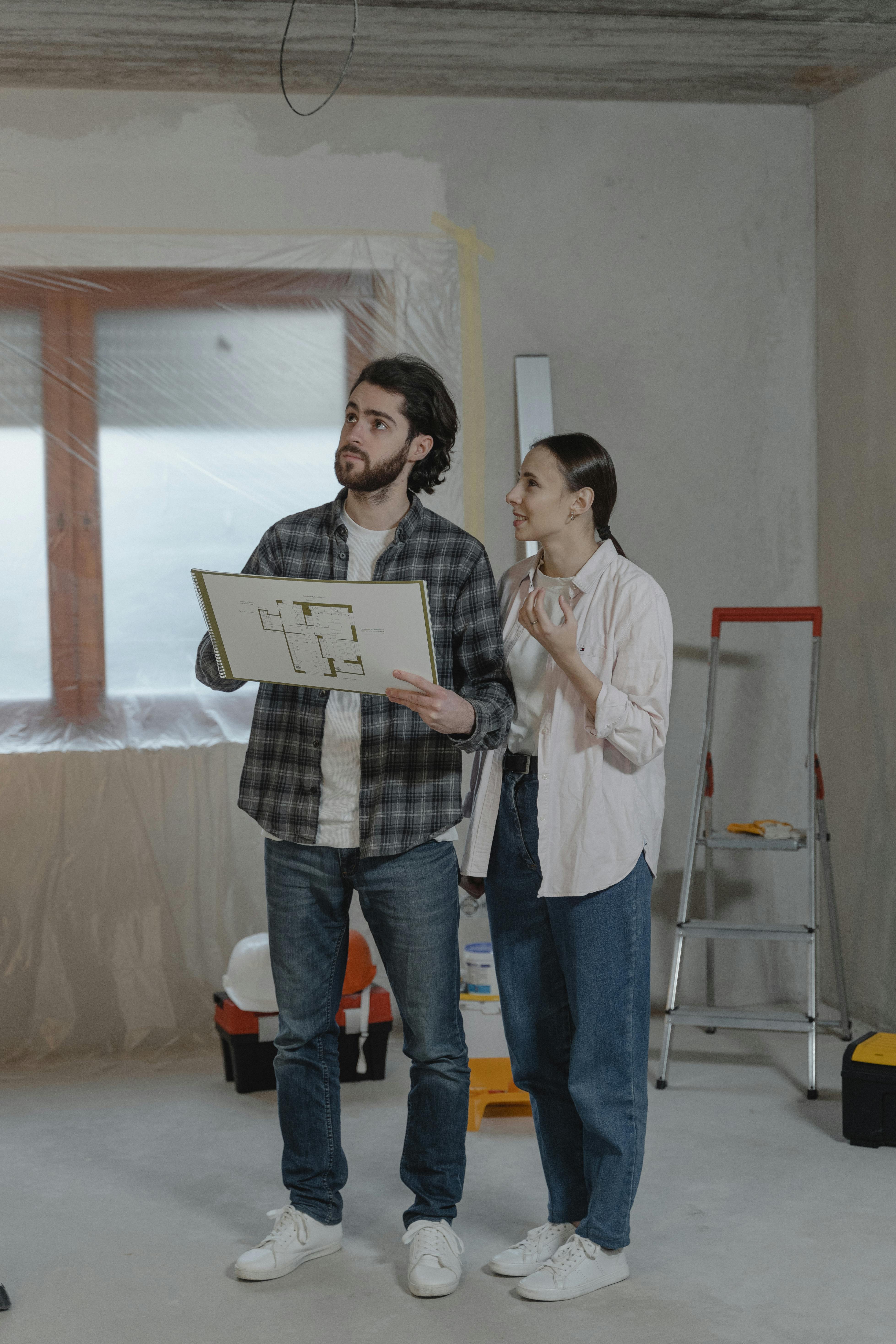Handyman professionals reviewing renovation plans